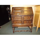 A mahogany writing bureau with front ope