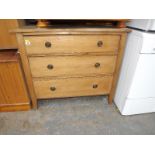 A set of pine chest of drawers with meta