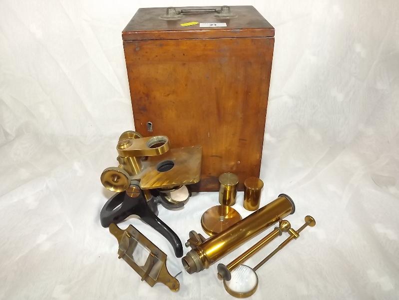 A early 20th century brass microscope wi
