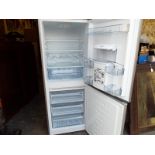 A Beko upright fridge freezer with water