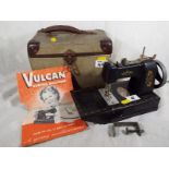 A Vulcan childs sewing machine with manu