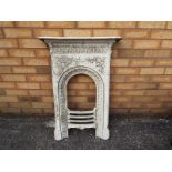 A cast iron fireplace with grate 89cm(h)