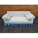 A compact two seater sofa upholstered in