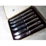 A George V cased set of six silver butte