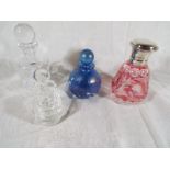 Four modern perfume bottles with stopper