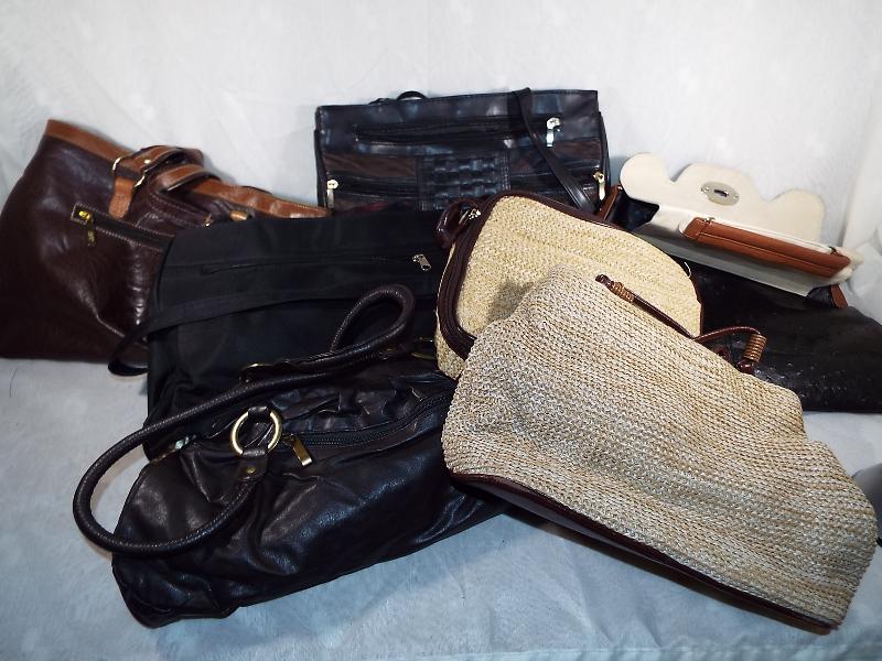 Seven lady's handbags predominantly leat