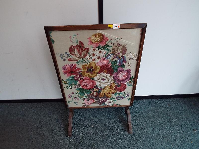 A fire screen tapestry which converts to