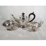 A George V silver tea set, teapot, sugar