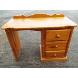 A pine desk with 3 drawers 76cm x 100cm