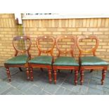 Four mahogany balloon backed chairs with