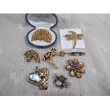 A collection of good quality brooches to include enamelled, mother of pearl, stone set and similar