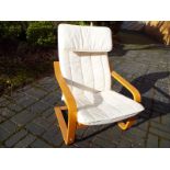 A modern beech and upholstered easy chair