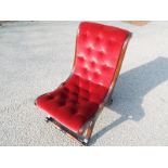 A cherry red button back chair