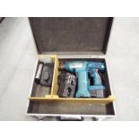 A Makita 24 volt cordless drill complete