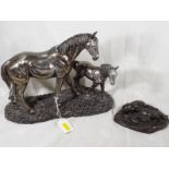 A cold cast figurine depicting a mare wi