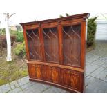 A concave bookcase with astral glazed fr