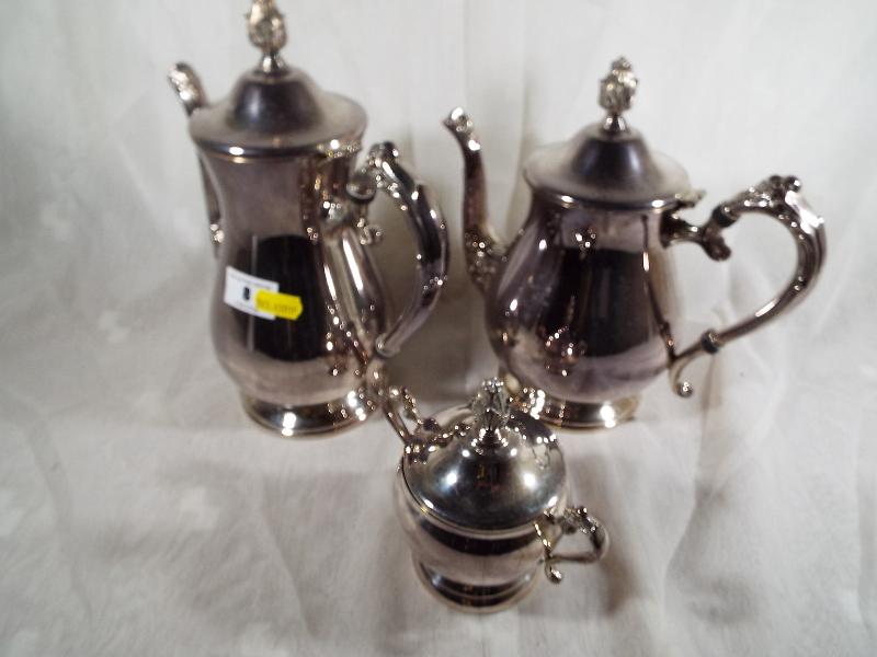 A plated three piece tea / coffee servic