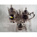 A plated three piece tea / coffee servic