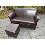 A brown leather two seater sofa 84cm (h) x 125cm (w)  x 72cm (d) - included in the lot in a brown