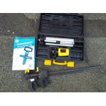 A surveyors level in case, a silverline open reel surveyors tape, boxed and two 24 inch quick