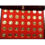 A cased two-drawer set comprising 70 coins depicting 'Our Royal Sovereigns' gold plated on silver -