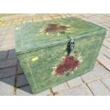 A green painted chest with floral design