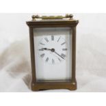 An early 20th century brass cased carriage timepiece, the case having five bevelled glasses,