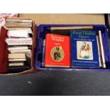 Two boxes of reference books covering an