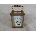A French brass and glass panel carriage clock, Roman numeral on a white dial - £30 - £40