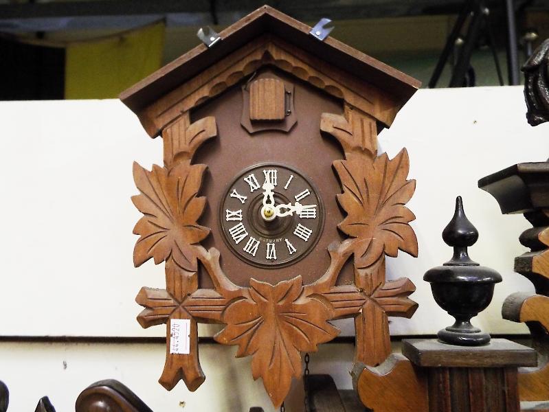 A  carved wood wall mounted 30 hour cuckoo clock with pendulum Est £20 - £30