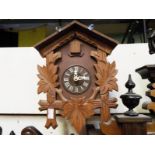 A  carved wood wall mounted 30 hour cuckoo clock with pendulum Est £20 - £30