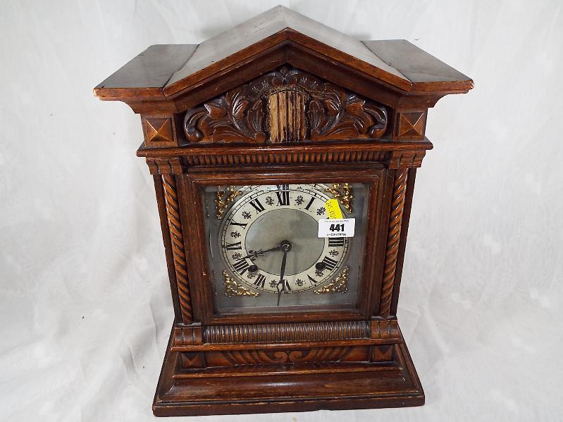 A bracket style mantel clock, the hour and half past gong strike movement by Jughans, the carved - Image 2 of 2