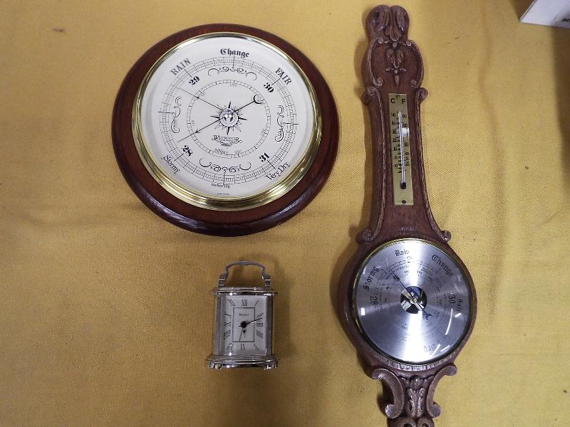 Two wall mounted aneroid barometers and a quartz carriage clock (3) Est £10 - £20