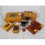 A collection of Mauchline Ware, carved wooden trinkets boxes, napkin ring and similar - Est £60 -