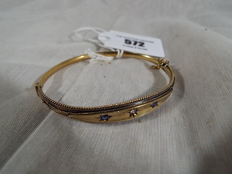 A lady's stone-set yellow metal bracelet stamped 15ct (15 carat) set with old cut diamond and