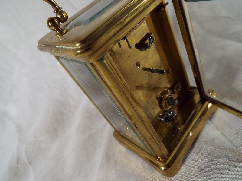 A French brass and glass panel carriage clock , Roman numerals on a white dial, with lever - Image 2 of 3
