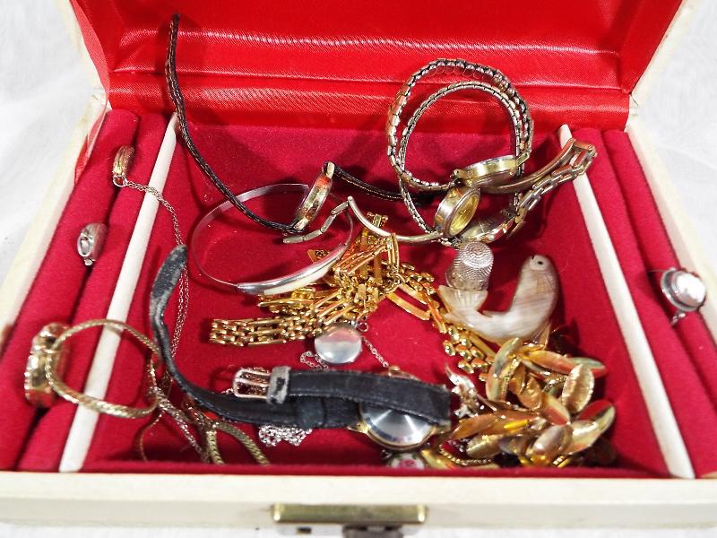 A jewellery box containing a quantity of good costume jewellery to include some silver