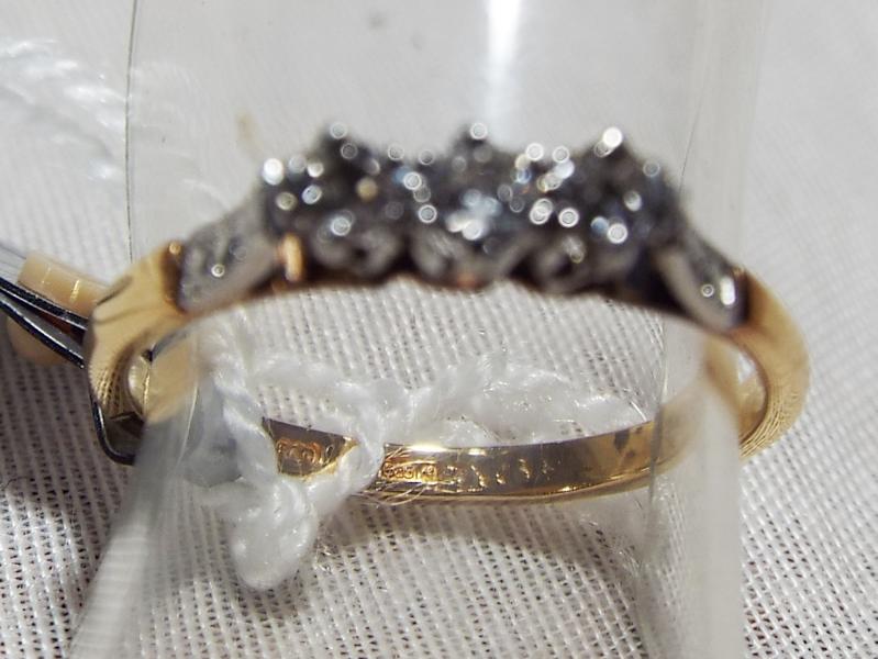 A lady's 14 carat gold ring set with three diamonds, approximate weight 2.12 gm (all in) Est £80 -