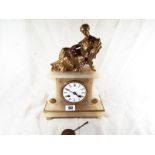 An alabaster mantle clock with relief decoration of a reclining lady, with bell striking and