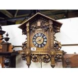 A wall mounted cuckoo clock with oak leaf and other moulded decoration Est £20 - £30