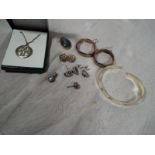 A collection of silver jewellery to include a hallmarked torque bracelet, earrings, necklace and