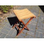 An early 20th century folding stool