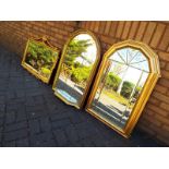 Three modern gilt framed wall mirrors