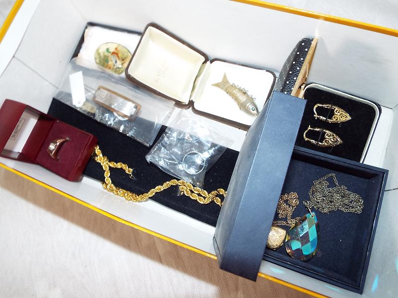 A good mixed lot of costume jewellery to include a silver hallmarked hair clip, a white metal