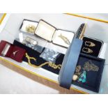 A good mixed lot of costume jewellery to include a silver hallmarked hair clip, a white metal