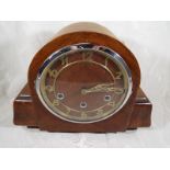 An Art Deco style mantel clock, oak case with applied skeletonised chapter ring and chrome bezel,