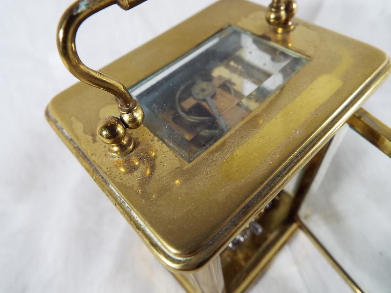 A French brass and glass panel carriage clock , Roman numerals on a white dial, with lever - Image 3 of 3