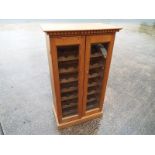 A pine wine storage cabinet, 122 cm x 72 cm x 40 cm