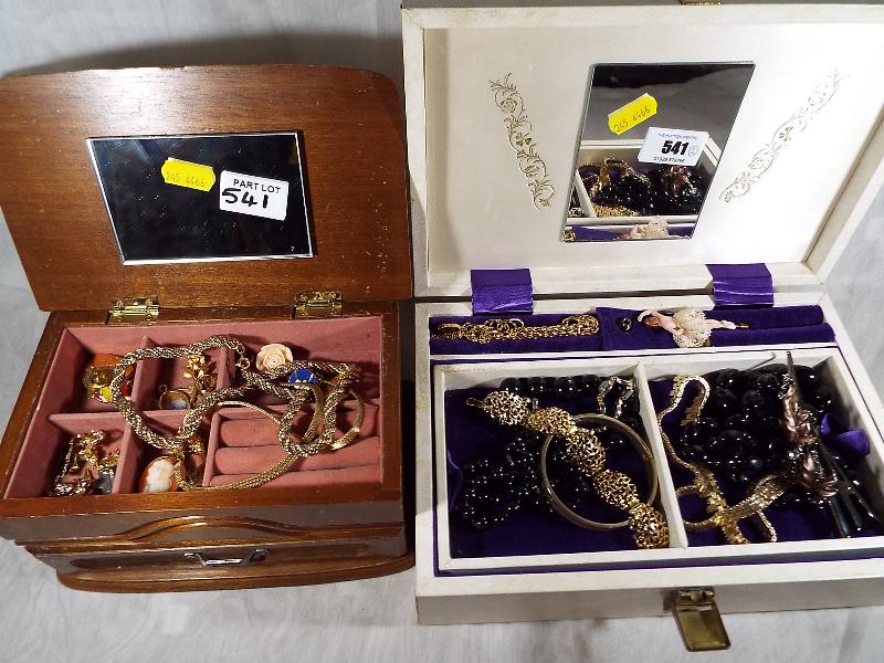 Two jewellery boxes containing a small collection of costume jewellery (2)