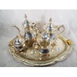 A silver plated tea set comprising tray teapot, sugar and creamer